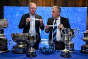 9 December 2024; Sean Buckley, Director for Area East at Bank of Ireland, left, and Conor Montayne, Leinster Rugby Schools committee chairperson reveal the names for the Senior Schools cup games during the Bank of Ireland Leinster School's Cup Draw at the Bank of Ireland Montrose Branch in Dublin. Photo by David Fitzgerald/Sportsfile