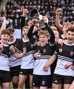 13 December 2024; Newbridge College captain Daniel Liston, 9, lifts the cup after his side's victory in the Leinster Rugby Schools Junior League Division 1A final match between Newbridge College and St Vincent's Castleknock College at Energia Park in Dublin. Photo by Piaras Ó Mídheach/Sportsfile