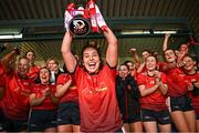 15 December 2024; Mungret St Paul’s captain Áine Ryan lifts the torphy after her side's victory in the 2024 AIB All-Ireland Ladies Junior Club Football Championship Final match between Mungret St Paul’s, Limerick, and Na Dúnaibh, Donegal, at Parnell Park in Dublin. Photo by Seb Daly/Sportsfile