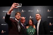 15 December 2024; Olympic gold and bronze medalist Daniel Wiffen, left, poses with his father Jonathan, mother Rachel, and brother Ben during the RTÉ Sports Awards 2024 at RTÉ studios in Donnybrook, Dublin. Photo by Ben McShane/Sportsfile