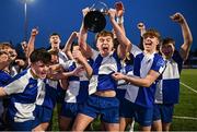 18 December 2024; St Andrew's College captain Victor Killane lifts the trophy alongside teammates after their side's victory in the Leinster Rugby Schools Senior League Division 1B Play-off Final match between Temple Carrig School, Wicklow, and St Andrew's College, Dublin, at Energia Park in Dublin. Photo by Seb Daly/Sportsfile