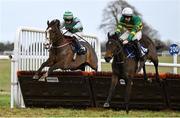 21 December 2024; Jeaniemacaroney, with Peter Thomas Smithers up, right, jump the last ahead of Wee Charlie, with Aidan Patrick Kelly up, who finished second, on their way to winning the The Wishing Everyone A Safe & Happy Christmas Handicap Hurdle at Thurles Racecourse in Tipperary. Photo by Shauna Clinton/Sportsfile