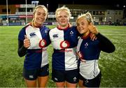 22 December 2024; Wolfhounds players, from left, Stacey Flood, Dannah O’Brien and Aoife Dalton after their side's victory in the Celtic Challenge match between Wolfhounds and Clovers at Energia Park in Dublin. Photo by Seb Daly/Sportsfile