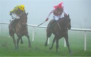 26 December 2024; Hello Neighbour, with Keith Donoghue  up, right, on the way to winning The O`Driscolls Irish Whiskey Juvenile Hurdle race on day one of the Leopardstown Christmas Festival at Leopardstown Racecourse in Dublin. Photo by Shauna Clinton/Sportsfile