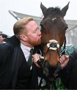 27 December 2024; Owner Neil Sands kisses Solness after sending him out to win the Paddy's Rewards Club Steeplechase (Grade 1) 5-y-o plus on day two of the Leopardstown Christmas Festival at Leopardstown Racecourse in Dublin. Photo by David Fitzgerald/Sportsfile