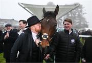 27 December 2024; Owner Neil Sands kisses Solness after sending him out to win the Paddy's Rewards Club Steeplechase (Grade 1) 5-y-o plus on day two of the Leopardstown Christmas Festival at Leopardstown Racecourse in Dublin. Photo by David Fitzgerald/Sportsfile