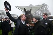 27 December 2024; Owners Neil, left, and Con Sands kiss Solness after sending him out to win the Paddy's Rewards Club Steeplechase (Grade 1) 5-y-o plus on day two of the Leopardstown Christmas Festival at Leopardstown Racecourse in Dublin. Photo by David Fitzgerald/Sportsfile