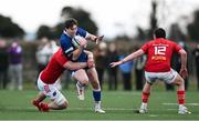 27 December 2024; Charlie Tector of Leinster A is tackled by Ruadhán Quinn of Munster A during the A Interprovincial Rugby Championship match between Munster A and Leinster A at New Ormond Park in Nenagh, Tipperary. Photo by Brendan Moran/Sportsfile