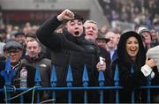 27 December 2024; A racegoer celebrates while watching the Spinal Injuries Ireland Handicap Hurdle 4-y-o plus on day two of the Leopardstown Christmas Festival at Leopardstown Racecourse in Dublin. Photo by David Fitzgerald/Sportsfile