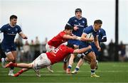 27 December 2024; Aitzol Arenzana-King of Leinster A is tackled by Gene O’Leary Kareem and Ruadhán Quinn of Munster A during the A Interprovincial Rugby Championship match between Munster A and Leinster A at New Ormond Park in Nenagh, Tipperary. Photo by Brendan Moran/Sportsfile