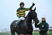 27 December 2024; Jockey Mark Walsh celebrates on Perceval Legallois, with groome Hannah Kehoe after winning the Paddy Power Steeple chase 5-y-o plus on day two of the Leopardstown Christmas Festival at Leopardstown Racecourse in Dublin. Photo by David Fitzgerald/Sportsfile