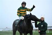 27 December 2024; Jockey Mark Walsh celebrates on Perceval Legallois, with groome Hannah Kehoe after winning the Paddy Power Steeple chase 5-y-o plus on day two of the Leopardstown Christmas Festival at Leopardstown Racecourse in Dublin. Photo by David Fitzgerald/Sportsfile