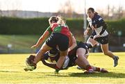 28 December 2024; Alma Atagamen of Wolfhounds scores her side's first try, under pressure from Alana McInerney of Clovers, during the Celtic Challenge match between Clovers and Wolfhounds at the UCD Bowl in Dublin. Photo by Piaras Ó Mídheach/Sportsfile