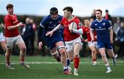 27 December 2024; Tom Wood of Munster A in action against Conor O’Tighearnaigh of Leinster A during the A Interprovincial Rugby Championship match between Munster A and Leinster A at New Ormond Park in Nenagh, Tipperary. Photo by Brendan Moran/Sportsfile