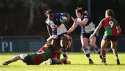 28 December 2024; Linda Djougang of Wolfhounds is tackled by Deirbhile Nic a Bháird, 7, and Jane Neill of Clovers during the Celtic Challenge match between Clovers and Wolfhounds at the UCD Bowl in Dublin. Photo by Piaras Ó Mídheach/Sportsfile