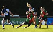 28 December 2024; Stacey Flood of Wolfhounds is tackled by Jane Neill of Clovers during the Celtic Challenge match between Clovers and Wolfhounds at the UCD Bowl in Dublin. Photo by Piaras Ó Mídheach/Sportsfile