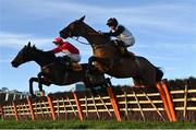 28 December 2024; Home By The Lee, left, with J J Slevin up, jumps the last alongside Bob Olinger, with Rachael Blackmore up, on their way to winning the Savills Hurdle (Grade 1) 4-y-o plus on day three of the Leopardstown Christmas Festival at Leopardstown Racecourse in Dublin. Photo by David Fitzgerald/Sportsfile