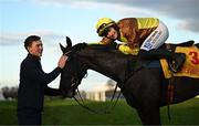 28 December 2024; Paul Townend celebrates on Galopin Des Champs, along with groom Adam Connolly, after winning the Savills Steeplechase (Grade 1) 5-y-o plus on day three of the Leopardstown Christmas Festival at Leopardstown Racecourse in Dublin. Photo by David Fitzgerald/Sportsfile