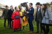 28 December 2024; Galopin Des Champs, centre, with jockey Paul Townend, winning connections, and trainer Willie Mullins, after they won the Savills Steeplechase (Grade 1) 5-y-o plus  on day three of the Leopardstown Christmas Festival at Leopardstown Racecourse in Dublin. Photo by David Fitzgerald/Sportsfile