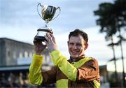 28 December 2024; Jockey Paul Townend with the trophy after winning the Savills Steeplechase (Grade 1) 5-y-o plus aboard Galopin Des Champs on day three of the Leopardstown Christmas Festival at Leopardstown Racecourse in Dublin. Photo by David Fitzgerald/Sportsfile