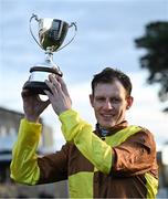 28 December 2024; Jockey Paul Townend with the trophy after winning the Savills Steeplechase (Grade 1) 5-y-o plus aboard Galopin Des Champs on day three of the Leopardstown Christmas Festival at Leopardstown Racecourse in Dublin. Photo by David Fitzgerald/Sportsfile