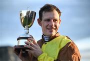 28 December 2024; Jockey Paul Townend with the trophy after winning the Savills Steeplechase (Grade 1) 5-y-o plus aboard Galopin Des Champs on day three of the Leopardstown Christmas Festival at Leopardstown Racecourse in Dublin. Photo by David Fitzgerald/Sportsfile