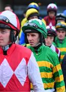 29 December 2024; Jockey Mark Walsh, centre, makes his way to the parade ring before competing on So Scottish in the Neville Hotels Premier Handicap Hurdle on day four of the Leopardstown Christmas Festival at Leopardstown Racecourse in Dublin. Photo by Shauna Clinton/Sportsfile