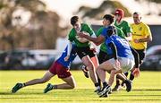 2 January 2025; Sam Bolger of South East is tackled by Cillian James, left, and Kevin Anatharajah of North Midlands during the BearingPoint Shane Horgan Cup Round 3 match between South East and North Midlands at Shay Murtagh Park in Mullingar, Westmeath. Photo by Ben McShane/Sportsfile