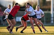 2 January 2025; Eimear Doonan of Midlands is tackled by Anna Cosgrove, centre, and Garace Cosgrove of North East during the BearingPoint Sarah Robinson Cup Round 3 match between Midlands and North East at Shay Murtagh Park in Mullingar, Westmeath. Photo by Ben McShane/Sportsfile