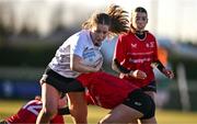 2 January 2025; Isabella Larkin of Midlands is tackled by Anna Cosgrove of North East during the BearingPoint Sarah Robinson Cup Round 3 match between Midlands and North East at Shay Murtagh Park in Mullingar, Westmeath. Photo by Ben McShane/Sportsfile