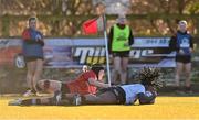 2 January 2025; Diana Izekor of Midlands scores her side's second try despite the tackle of Milita Valeryte of North East during the BearingPoint Sarah Robinson Cup Round 3 match between Midlands and North East at Shay Murtagh Park in Mullingar, Westmeath. Photo by Ben McShane/Sportsfile