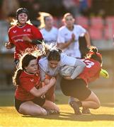 2 January 2025; Sophie McDonagh of Midlands is tackled by Emma O'Rourke, left, and Anna Allison of North East during the BearingPoint Sarah Robinson Cup Round 3 match between Midlands and North East at Shay Murtagh Park in Mullingar, Westmeath. Photo by Ben McShane/Sportsfile