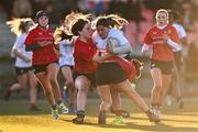 2 January 2025; Sophie McDonagh of Midlands is tackled by Emma O'Rourke, left, and Anna Allison of North East during the BearingPoint Sarah Robinson Cup Round 3 match between Midlands and North East at Shay Murtagh Park in Mullingar, Westmeath. Photo by Ben McShane/Sportsfile