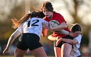 2 January 2025; Emma O'Rourke of North East is tackled by Sophie McDonagh, left, and Emma Wiseman of Midlands during the BearingPoint Sarah Robinson Cup Round 3 match between Midlands and North East at Shay Murtagh Park in Mullingar, Westmeath. Photo by Ben McShane/Sportsfile