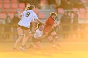 2 January 2025; Jessica Dempsey of North East is tackled by Eimear Doonan of Midlands during the BearingPoint Sarah Robinson Cup Round 3 match between Midlands and North East at Shay Murtagh Park in Mullingar, Westmeath. Photo by Ben McShane/Sportsfile