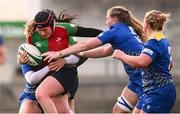 4 January 2025; Beth Buttimer of Clovers is tackled by Molly Anderson-Thomas, left, and Gwennan Hopkins of Gwalia Lightning during the Celtic Challenge match between Clovers and Gwalia Lightning at Kingspan Stadium in Belfast. Photo by Ramsey Cardy/Sportsfile