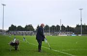 4 January 2025; Groundsman Paddy Maloney applies the finishing touches to the sideline before the AIB GAA Football All-Ireland Intermediate Club Championship semi-final match between Austin Stacks and Ballinderry at Parnell Park in Dublin. Photo by Ben McShane/Sportsfile