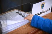 4 January 2025; A spectator takes a teamsheet before the Intercounty Hurling Challenge Match between Waterford and Cork at Fraher Field in Dungarvan, Waterford. Photo by Seb Daly/Sportsfile