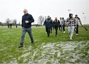 4 January 2025; Clare manager Brian Lohan leaves the pitch with players and staff before the Intercounty Hurling Challenge Match between Tipperary and Clare at Páirc Shilean in Templemore, Tipperary. Photo by David Fitzgerald/Sportsfile