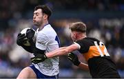 4 January 2025; Eoin Devlin of Ballinderry is tackled by Daniel Kirby of Austin Stacks during the AIB GAA Football All-Ireland Intermediate Club Championship semi-final match between Austin Stacks and Ballinderry at Parnell Park in Dublin. Photo by Ben McShane/Sportsfile