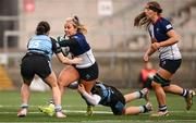 4 January 2025; Aoife Dalton of Wolfhounds is tackled by Sky Phimster, left, and Orla Proctor of Glasgow Warriors during the Celtic Challenge match between Wolfhounds and Glasgow Warriors at Kingspan Stadium in Belfast. Photo by Ramsey Cardy/Sportsfile