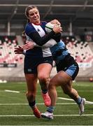 4 January 2025; Katie Corrigan of Wolfhounds on her way to scoring her side's second try despite the tackle of Grace Deane of Glasgow Warriors during the Celtic Challenge match between Wolfhounds and Glasgow Warriors at Kingspan Stadium in Belfast. Photo by Ramsey Cardy/Sportsfile