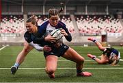 4 January 2025; Katie Corrigan of Wolfhounds scores her side's second try despite the tackle of Grace Deane of Glasgow Warriors during the Celtic Challenge match between Wolfhounds and Glasgow Warriors at Kingspan Stadium in Belfast. Photo by Ramsey Cardy/Sportsfile