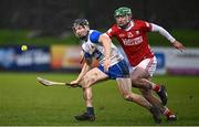 4 January 2025; Jamie Barron of Waterford in action against Brian Roche of Cork during the Intercounty Hurling Challenge Match between Waterford and Cork at Fraher Field in Dungarvan, Waterford. Photo by Seb Daly/Sportsfile