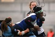 4 January 2025; Alma Atagamen of Wolfhounds is tackled by Gemma Bell, left, and Erinn Foley of Glasgow Warriors during the Celtic Challenge match between Wolfhounds and Glasgow Warriors at Kingspan Stadium in Belfast. Photo by Ramsey Cardy/Sportsfile