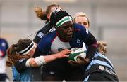 4 January 2025; Alma Atagamen of Wolfhounds is tackled by Gemma Bell, left, and Erinn Foley of Glasgow Warriors during the Celtic Challenge match between Wolfhounds and Glasgow Warriors at Kingspan Stadium in Belfast. Photo by Ramsey Cardy/Sportsfile