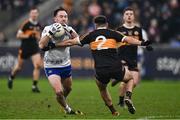 4 January 2025; Ryan O'Neill of Ballinderry is tackled by Colin Griffin of Austin Stacks during the AIB GAA Football All-Ireland Intermediate Club Championship semi-final match between Austin Stacks and Ballinderry at Parnell Park in Dublin. Photo by Ben McShane/Sportsfile