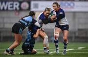 4 January 2025; Megan Burns of Wolfhounds is tackled by Orla Proctor and Briar McNamara of Glasgow Warriors during the Celtic Challenge match between Wolfhounds and Glasgow Warriors at Kingspan Stadium in Belfast. Photo by Ramsey Cardy/Sportsfile