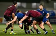 4 January 2025; Dan Barron of Leinster is tackled by Ireland players, from left, Aaron O'Brien, Billy Corrigan and Emmet Calvey during the friendly match between Ireland U20 and Leinster Development XV at Energia Park in Dublin. Photo by Ben McShane/Sportsfile