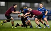 4 January 2025; Dan Barron of Leinster is tackled by Ireland players, from left, Aaron O'Brien, Billy Corrigan and Emmet Calvey during the friendly match between Ireland U20 and Leinster Development XV at Energia Park in Dublin. Photo by Ben McShane/Sportsfile